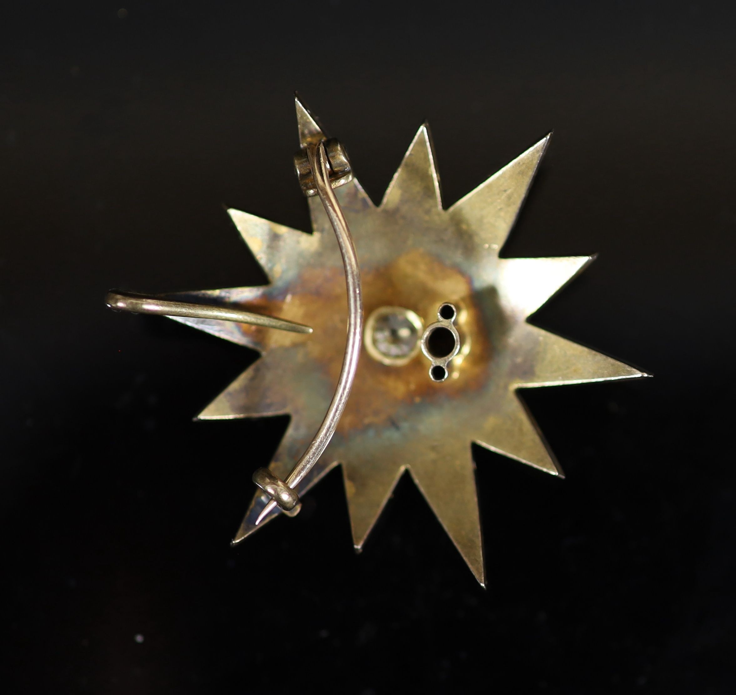 A Victorian gold, split pearl and diamond starburst pendant brooch